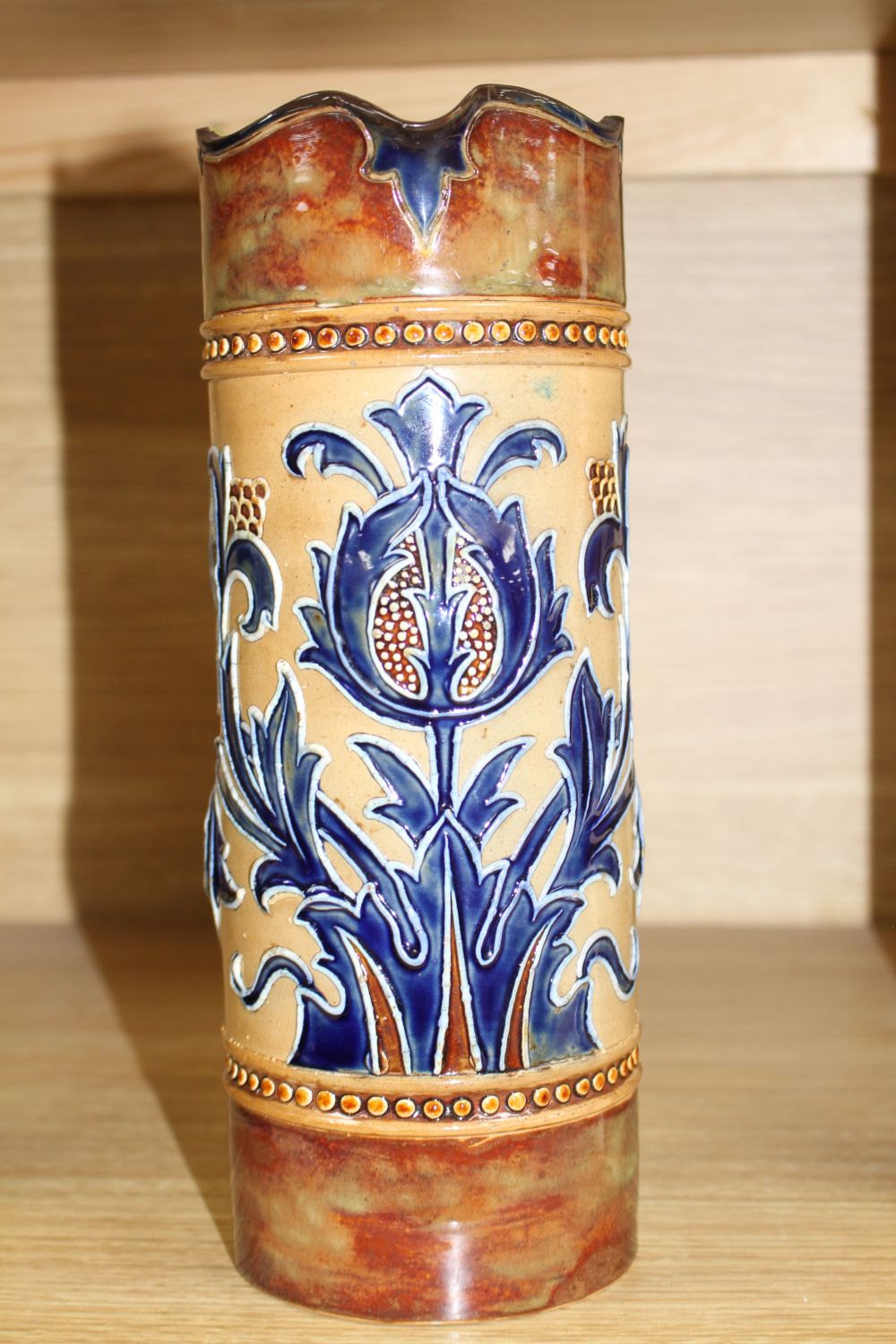 Mark V. Marshall for Doulton Lambeth, an Art Union of London jug, c.1895, the cylindrical body tube-lined with spikey flower and leaves